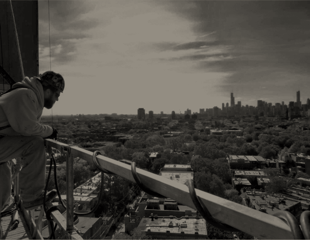 Construction Worker on a Building Site Overlooking a Skyline